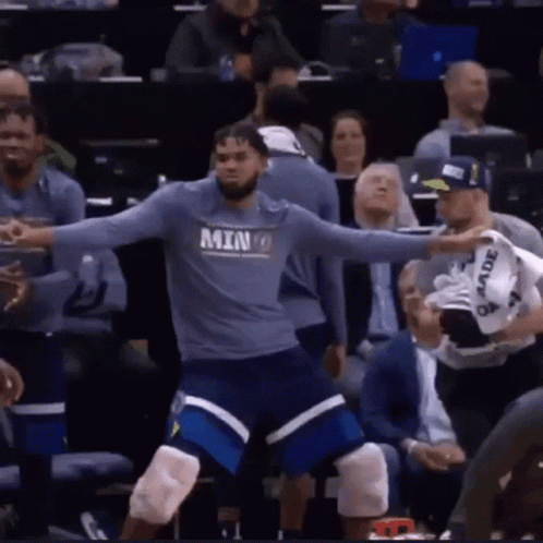 A Basketball Player Wearing A Shirt That Says Minnesota GIF