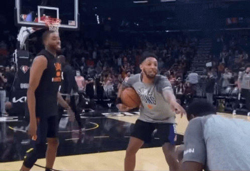 A Basketball Player Wearing A Shirt That Says Suns Is Dribbling The Ball GIF