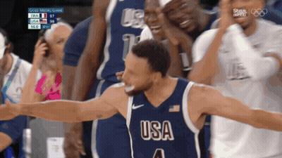 A Basketball Player Wearing A Usa Jersey Celebrates GIF
