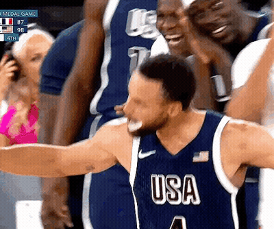 A Basketball Player Wearing A Usa Jersey Is Celebrating With His Teammates GIF