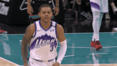 A Basketball Player Wearing A Utah Jersey With The Number 3 On It GIF