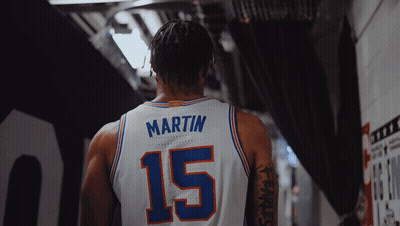 A Basketball Player Wearing A White Jersey With The Number 15 On It GIF