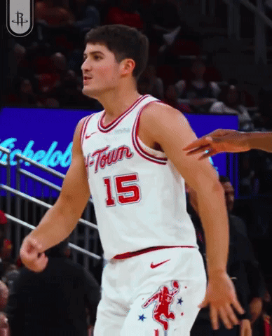 A Basketball Player Wearing A White Jersey With The Number 15 GIF