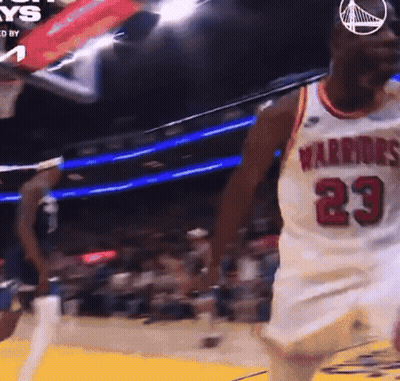 A Basketball Player Wearing A White Jersey With The Number 23 GIF