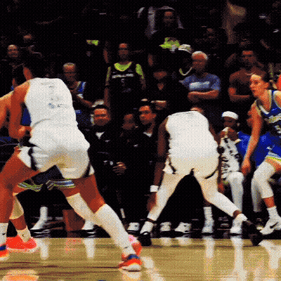 A Basketball Player Wearing A White Jersey With The Number 23 On The Back GIF