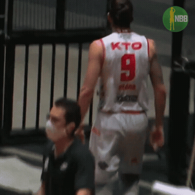 A Basketball Player Wearing A White Jersey With The Number 9 On The Back GIF