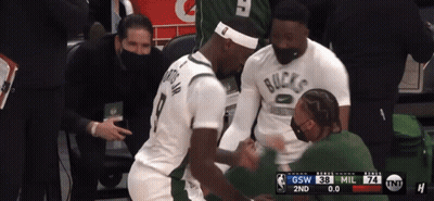 A Basketball Player Wearing A White Shirt That Says Bucks GIF