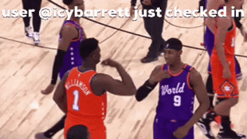 A Basketball Player Wearing A World Jersey High Fives Another Player On The Court GIF