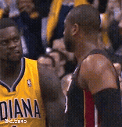 A Basketball Player Wearing A Yellow Diana Jersey Talks To Another Player GIF