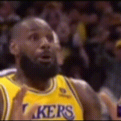 A Basketball Player Wearing A Yellow Jersey That Says Lakers On It GIF