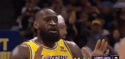 A Basketball Player Wearing A Yellow Jersey That Says Lakers GIF