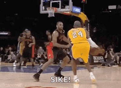 A Basketball Player Wearing A Yellow Jersey With The Number 24 On It Is Dribbling The Ball . GIF