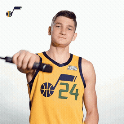 A Basketball Player Wearing A Yellow Jersey With The Number 24 On It GIF