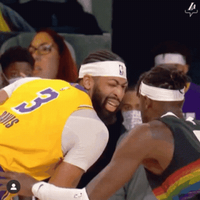 A Basketball Player Wearing A Yellow Jersey With The Number 3 On It GIF
