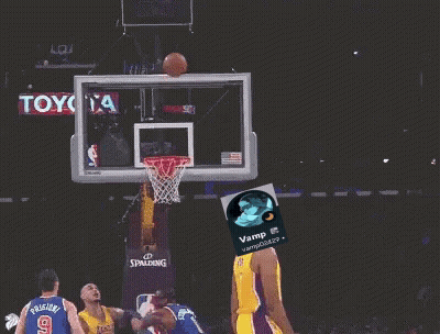 A Basketball Player Wearing A Yellow Lakers Jersey Throws A Basketball Through A Hoop GIF