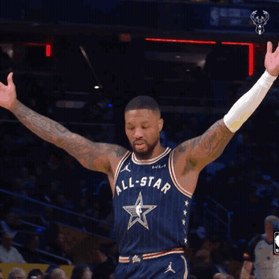 A Basketball Player Wearing An All Star Uniform Stands On The Court With His Arms Outstretched GIF