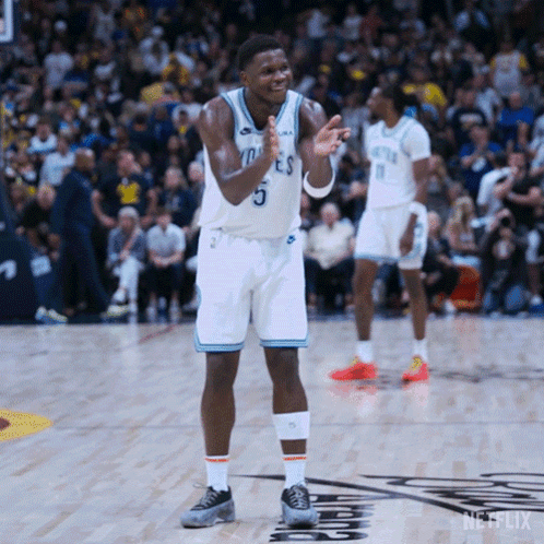 A Basketball Player Wearing Number 5 Applauds During A Game GIF