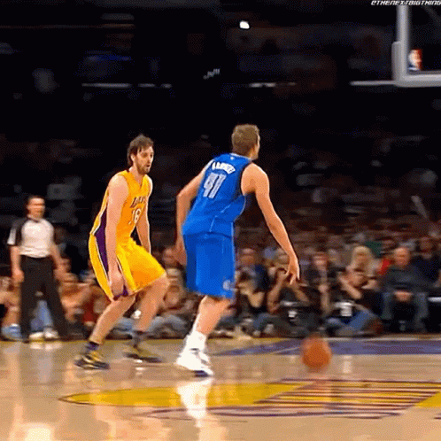 A Basketball Player Wearing Number 91 Dribbles The Ball GIF