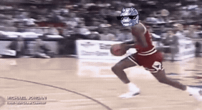 A Basketball Player Wearing Sunglasses And A Batman Mask Is Dribbling A Basketball . GIF
