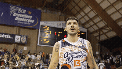 A Basketball Player Wears A Jersey That Says Gravelines Dunkerque GIF