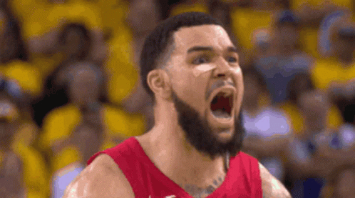 A Basketball Player With A Beard Is Screaming With His Mouth Wide Open . GIF