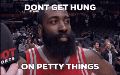 A Basketball Player With A Beard Is Talking Into A Microphone While A Crowd Watches . GIF