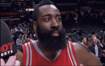 A Basketball Player With A Beard Is Talking To A Reporter . GIF