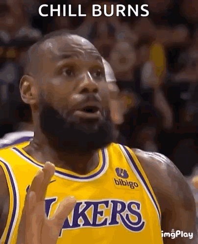 A Basketball Player With A Beard Is Wearing A Lakers Jersey And Making A Funny Face . GIF
