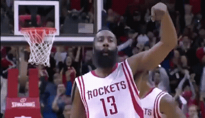 A Basketball Player With A Beard Wearing A Rockets Jersey Is Celebrating A Basket . GIF