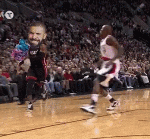 A Basketball Player With A Face On His Jersey Is Jumping In The Air . GIF