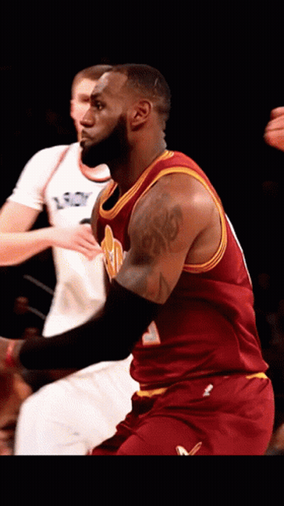 A Basketball Player With A Tattoo On His Arm Is Wearing A Red Jersey GIF