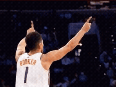 A Basketball Player With The Name Booker On His Shirt GIF