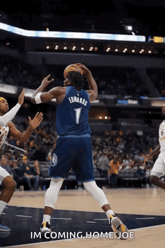 A Basketball Player With The Name Edwards On His Jersey Throws The Ball GIF
