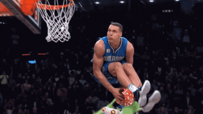 A Basketball Player With The Number 00 On His Jersey Is Dunking The Ball GIF