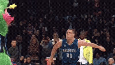A Basketball Player With The Number 00 On His Jersey Is Jumping In The Air GIF
