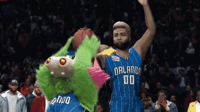 A Basketball Player With The Number 00 On His Jersey Stands Next To A Mascot GIF