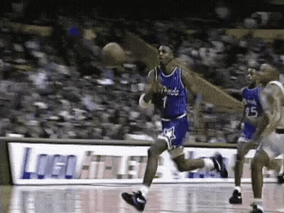 A Basketball Player With The Number 1 On His Jersey Is Dribbling The Ball On A Court . GIF