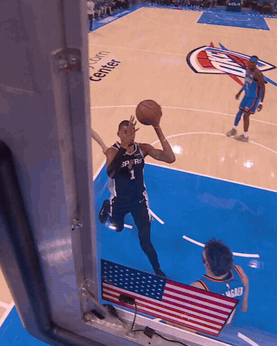 A Basketball Player With The Number 1 On His Jersey Is Jumping In The Air GIF