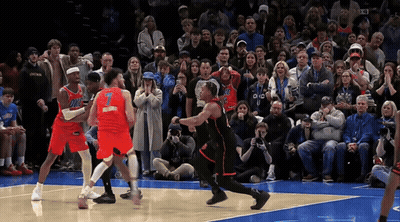 A Basketball Player With The Number 1 On His Jersey Is Surrounded By Other Players GIF