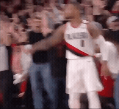 A Basketball Player With The Number 1 On His Jersey Stands In Front Of A Crowd . GIF