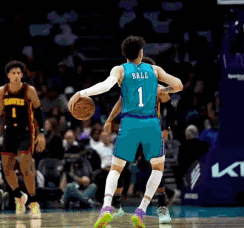A Basketball Player With The Number 1 On The Back Of His Jersey Is Holding A Basketball . GIF