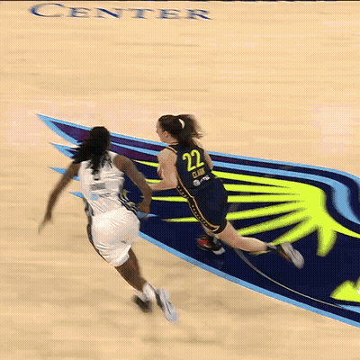 A Basketball Player With The Number 11 On Her Jersey Tries To Block A Shot GIF