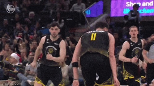 A Basketball Player With The Number 11 On His Back Is Standing Next To Another Player GIF
