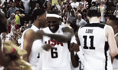 A Basketball Player With The Number 11 On His Jersey Is Hugging Another Player GIF