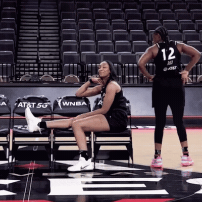 A Basketball Player With The Number 12 On Her Jersey GIF