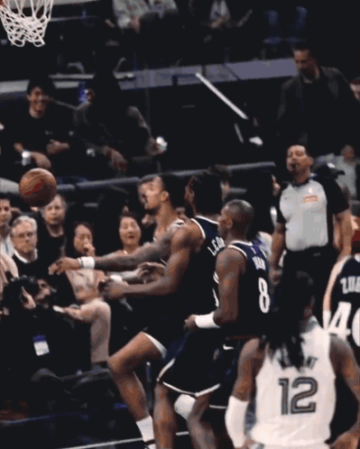 A Basketball Player With The Number 12 On His Back GIF