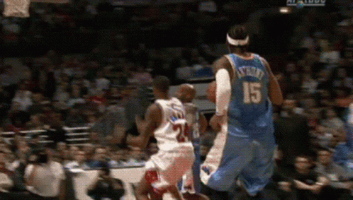A Basketball Player With The Number 15 On His Back Is Jumping In The Air GIF