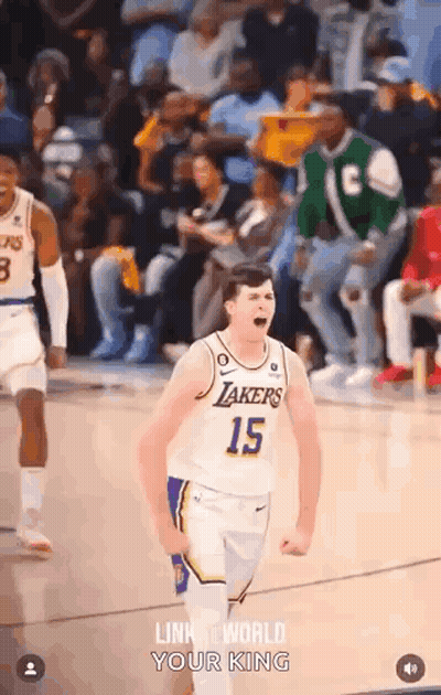 A Basketball Player With The Number 15 On His Jersey Is Celebrating On The Court During A Game . GIF