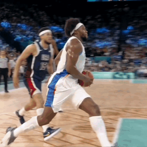 A Basketball Player With The Number 15 On His Jersey Is Dribbling The Ball GIF