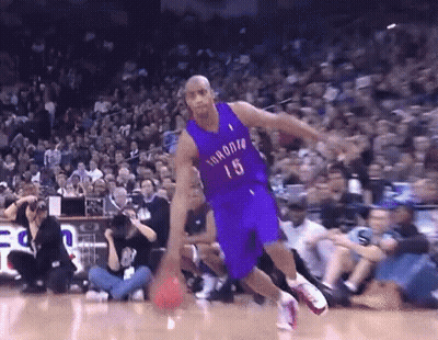 A Basketball Player With The Number 15 On His Jersey Is Dribbling The Ball GIF